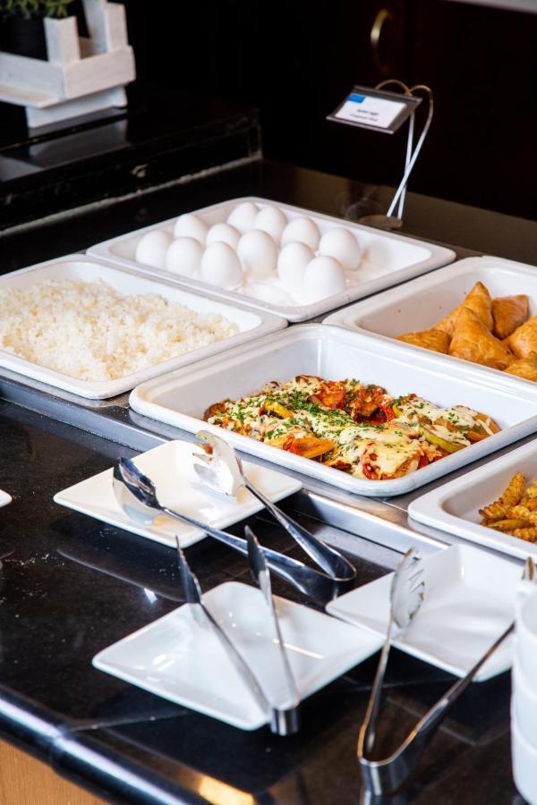 Rahat Palace Hotel Almaty Exterior photo A chafing dish buffet